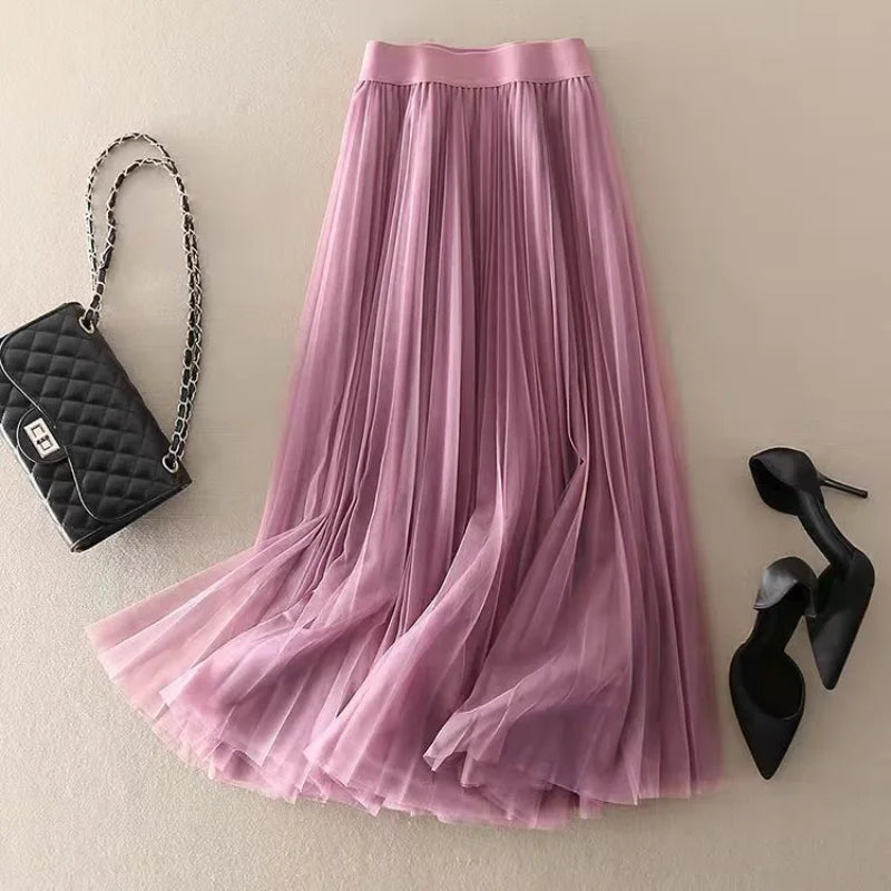 Flowing women's pleated midi skirt, high-waisted A-line cut enhances silhouette for an elegant and comfortable fit.