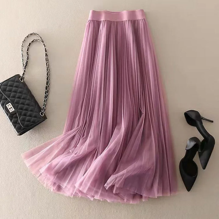 Flowing women's pleated midi skirt, high-waisted A-line cut enhances silhouette for an elegant and comfortable fit.