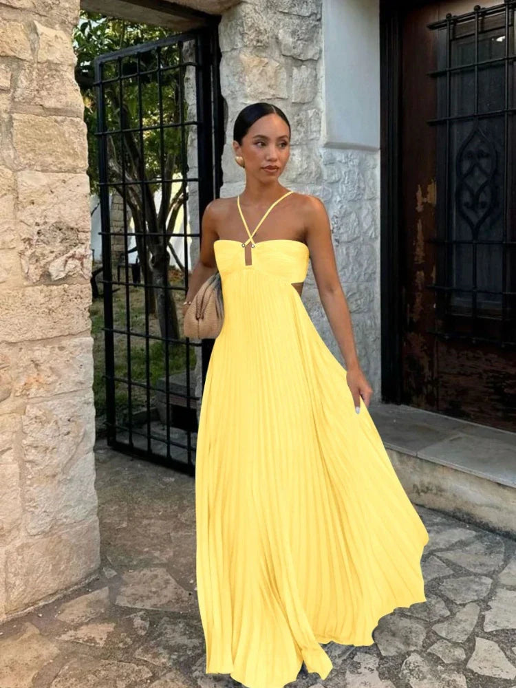 Modest long pleated maxi dress for women, offering elegant coverage and comfortable flowy style.