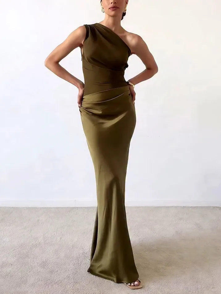 Sophisticated long pleated evening gown, ideal for women attending weddings or formal events.