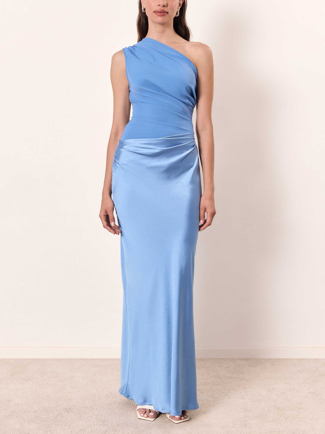 Beautiful women's pleated asymmetric long dress, a modern and elegant choice for wedding guests.