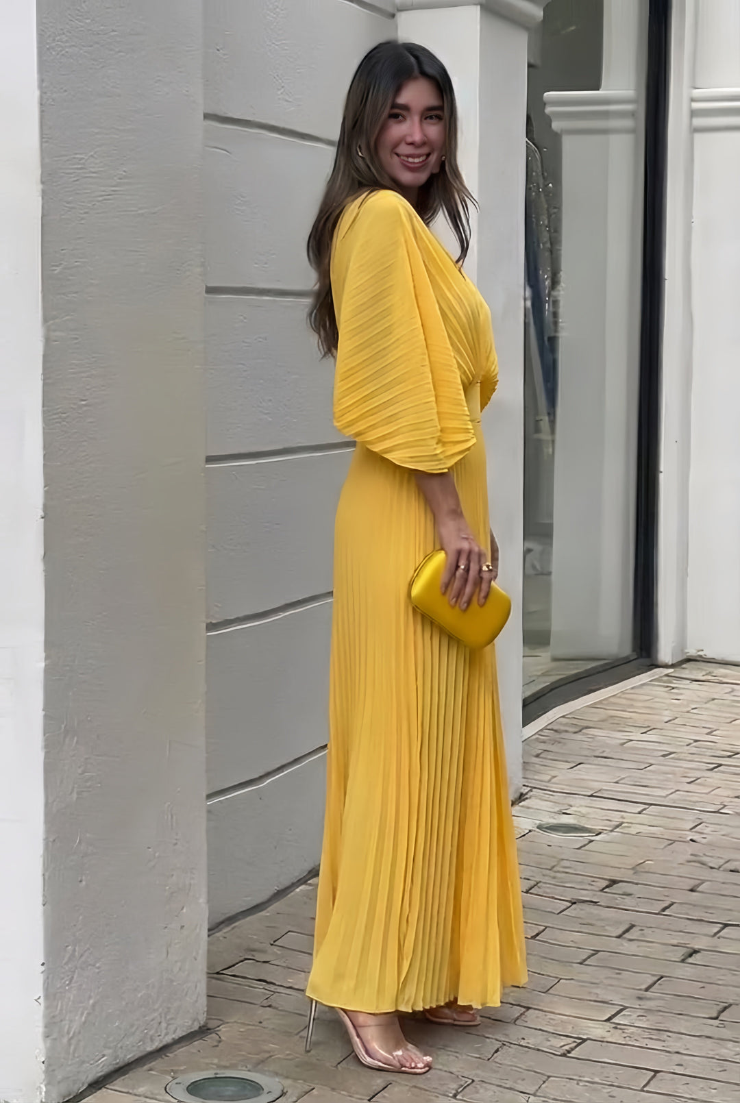Sophisticated long pleated maxi dress for women, featuring stylish kimono sleeves and a refined V-neck design.