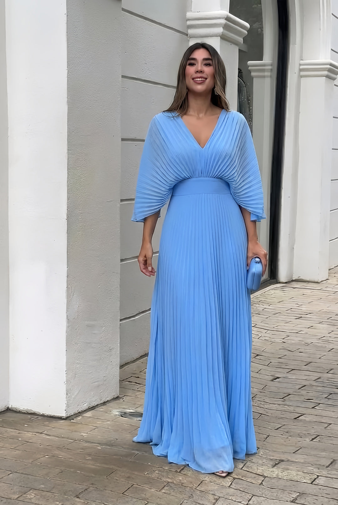 Beautiful women's occasion dress, a pleated maxi evening gown with elegant kimono sleeves and V-neck.