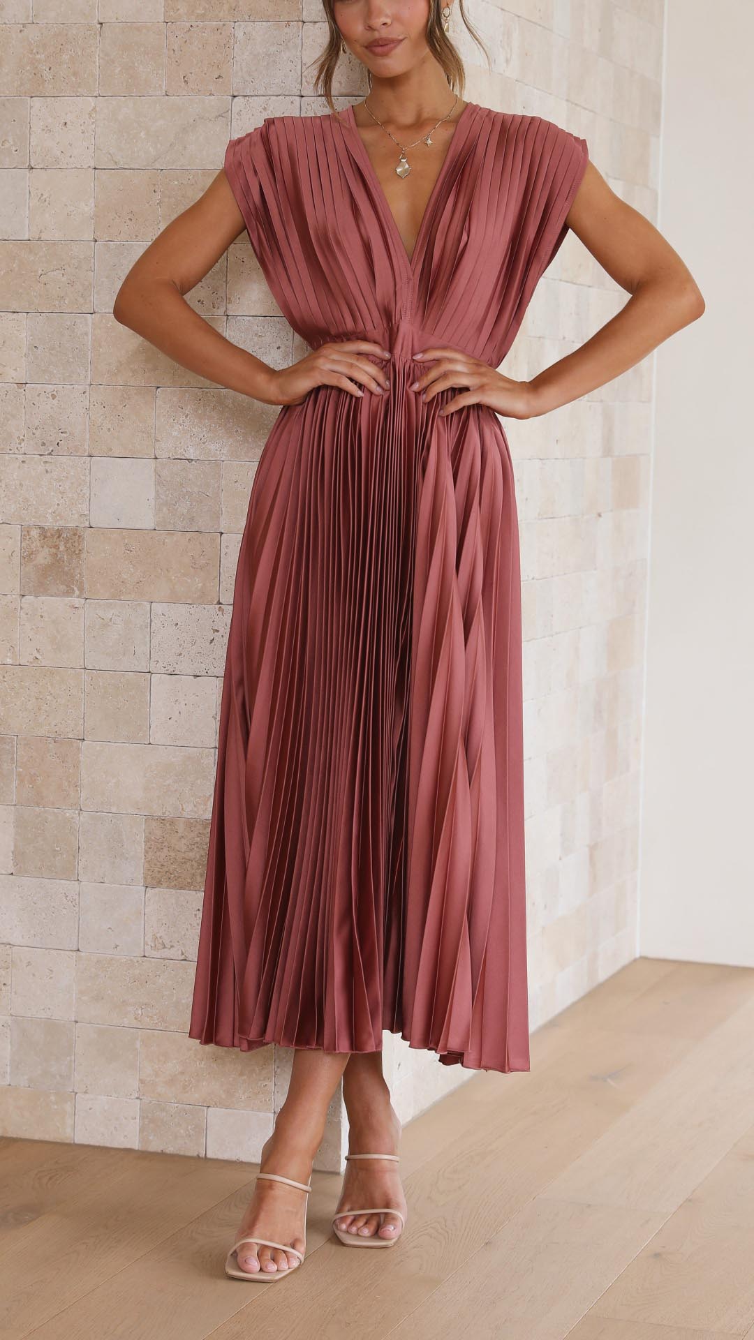Elegant women's pleated maxi dress with flowing silhouette, perfect for evening or formal events.