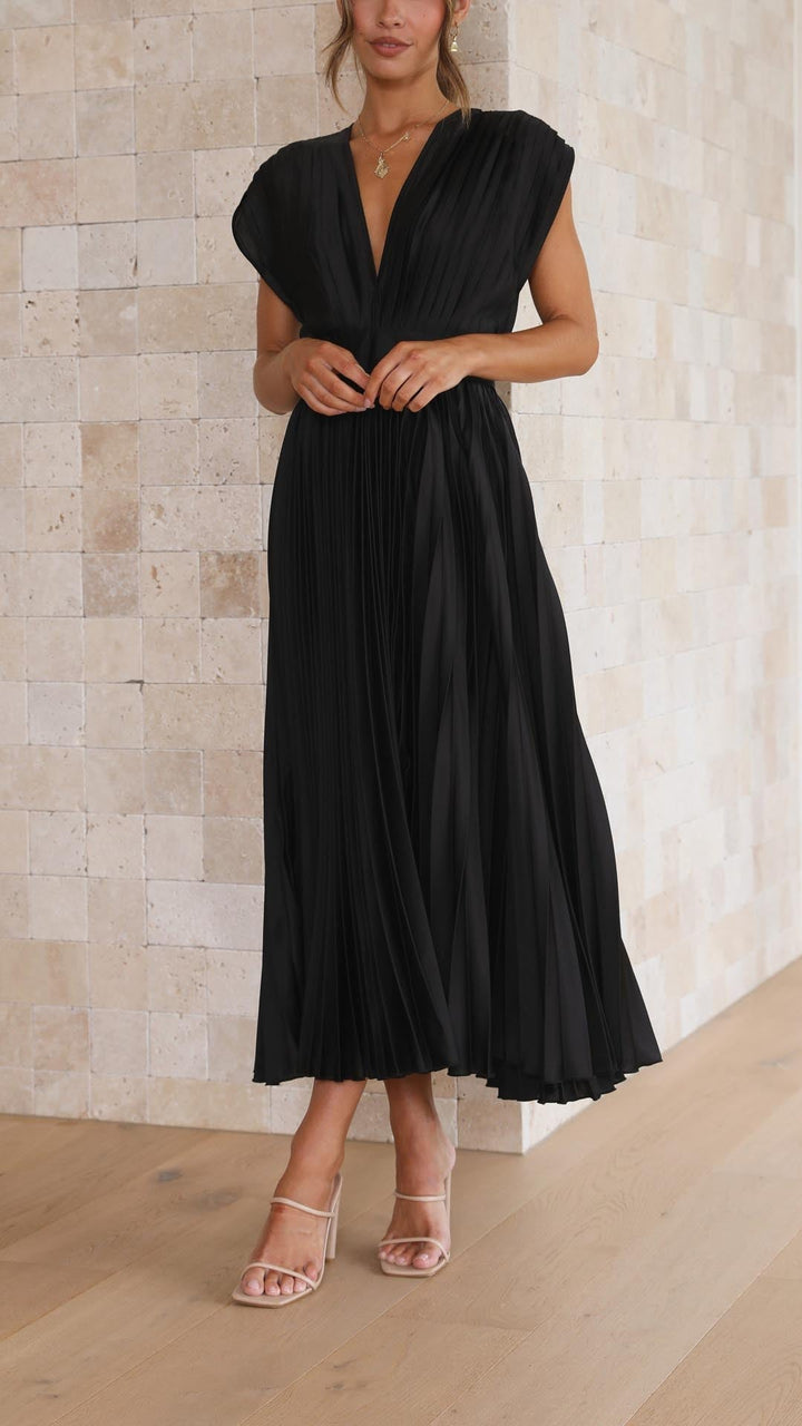 Get ready in this elegant women's pleated maxi dress, a chic flowing choice for all seasons.