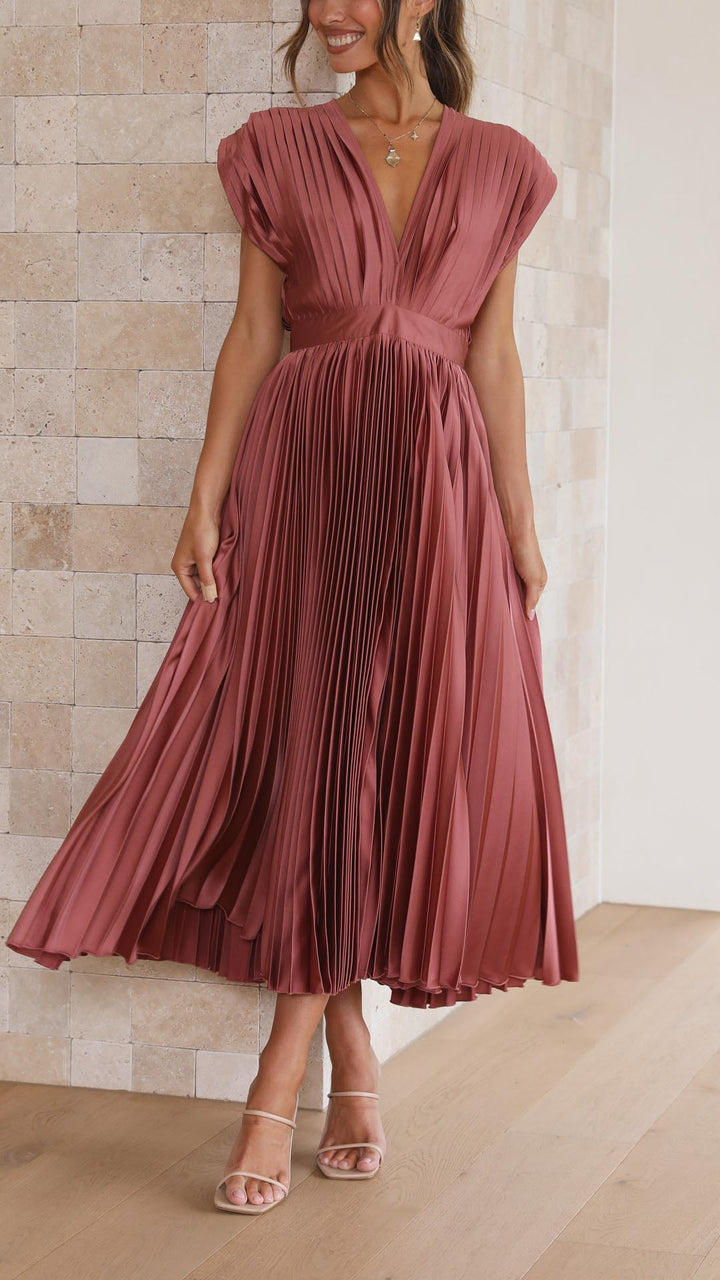 Timeless women's flowing maxi dress with delicate pleats, a versatile formal or casual option.