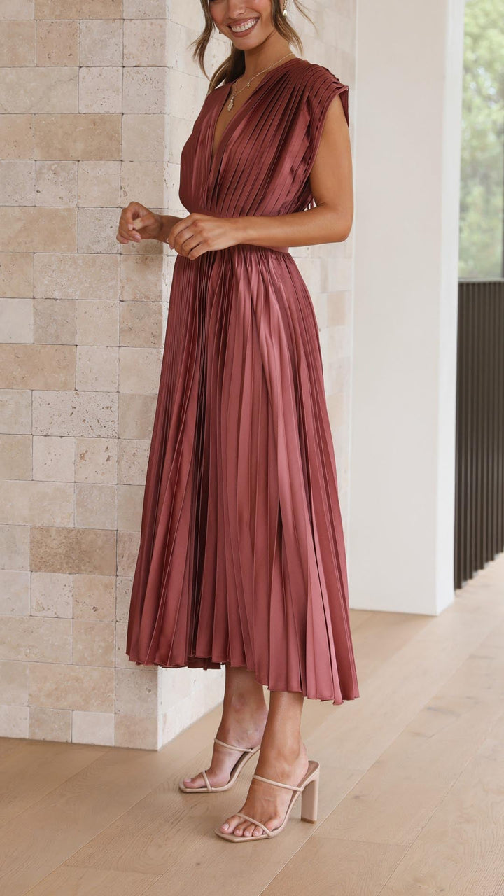 Women's evening maxi dress, beautifully pleated with a flowing, chic silhouette for parties.