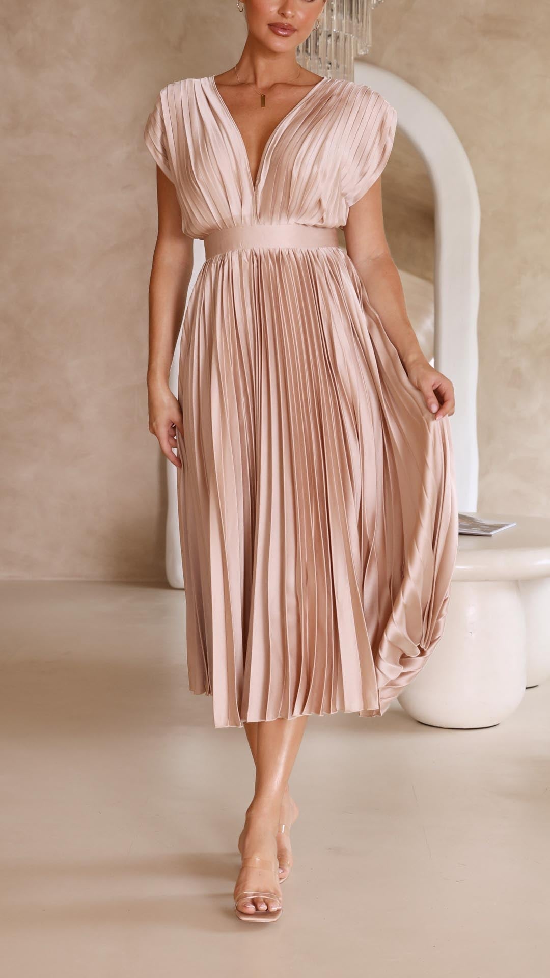 Stunning pleated long dress for women, offering an elegant, flowing look for day or night.