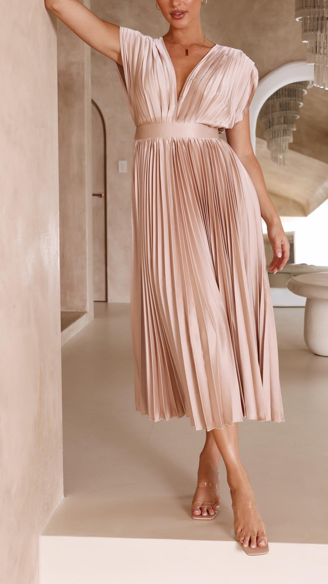 Stylish women's pleated maxi dress, a flowing silhouette that's chic and timeless for any event.