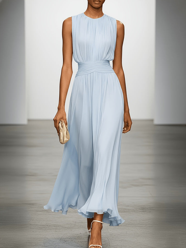 Chic wedding guest maxi dress; sleeveless, pleated, with a flattering ruched waist for special occasions.