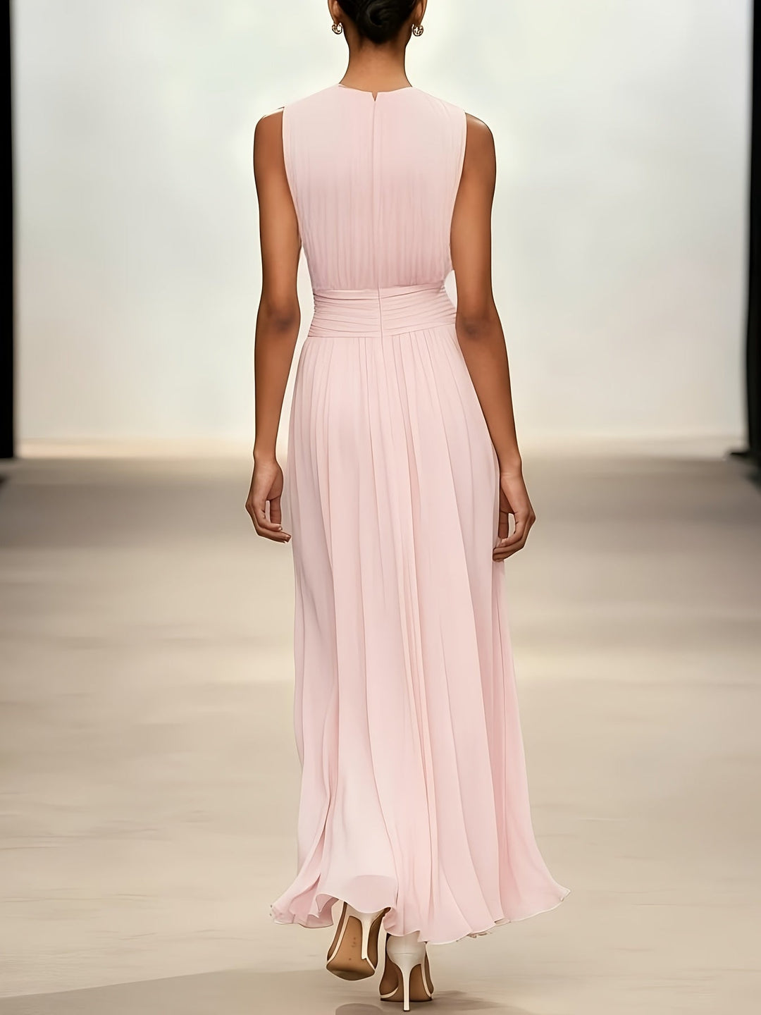 Elegant sleeveless pleated maxi dress with a ruched waist, a sophisticated choice for formal evening events.