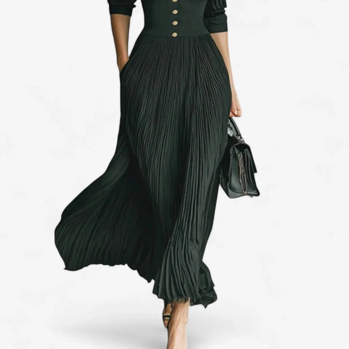 Stylish women's pleated maxi dress featuring a flattering V-neckline & 3/4 sleeves. Versatile occasion wear.