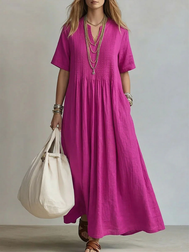 Elegant women's pleated maxi dress with V-neck. Perfect for summer fashion and casual wear, featuring a flowy, relaxed fit.