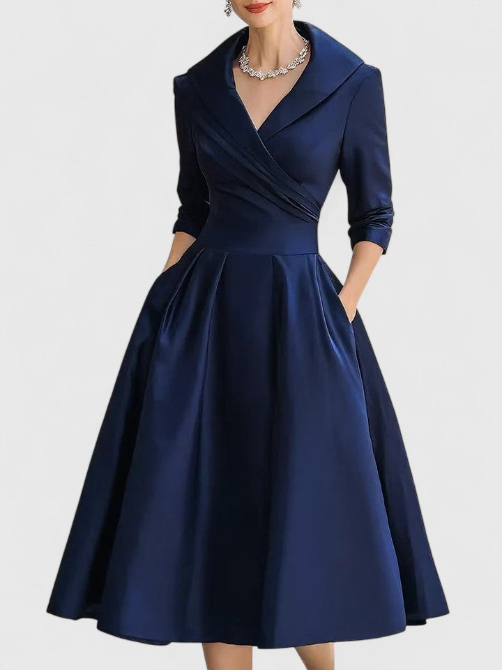 Elegant women's pleated midi dress with a flattering wrap bodice and short sleeves. Ideal for formal or holiday wear.