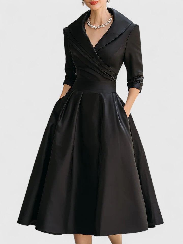 Sophisticated women's wrap midi dress with a flowing pleated skirt, perfect for elegant occasion wear or summer events.
