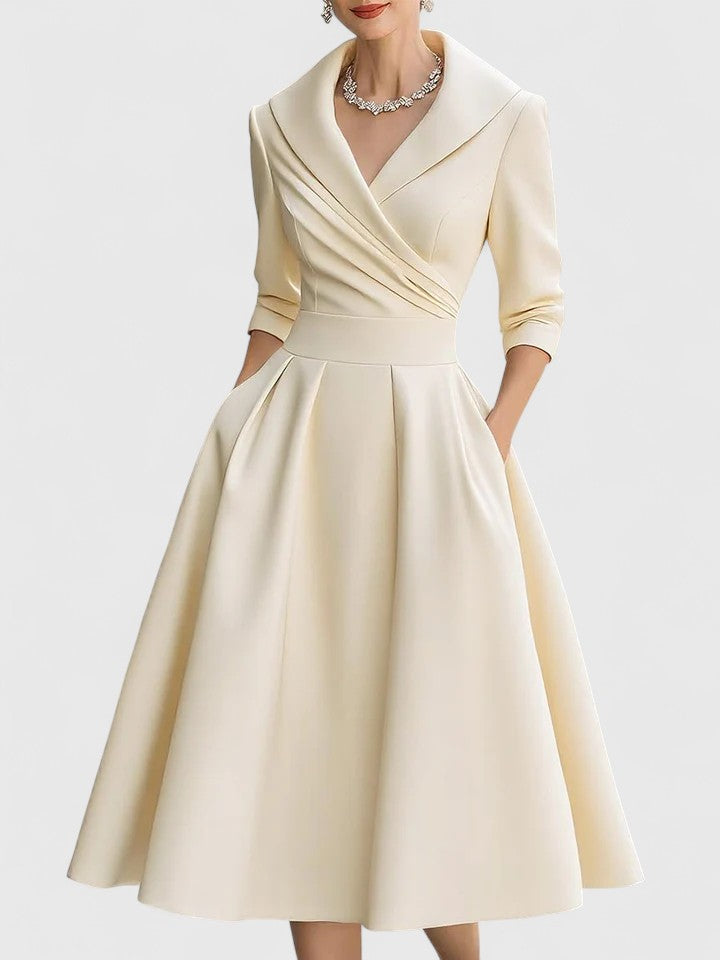 Model showcasing a graceful women's pleated midi dress with a stylish wrap bodice, ideal for summer or formal wear.