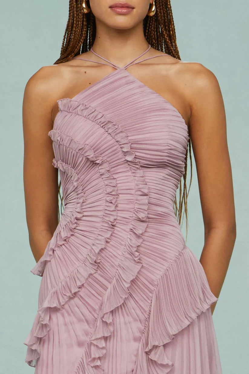 Long pleated women's dress with delicate ruffles, perfect for a chic wedding guest look.