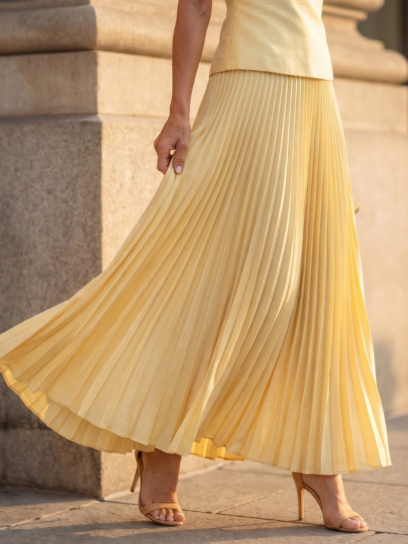 Formal women's outfit: elegant sleeveless structured bodice & flowing pleated midi skirt set. Sophisticated fashion.
