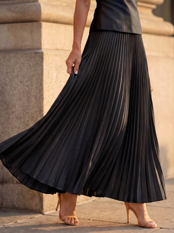 Casual chic women's pleated skirt & structured top set. Versatile sleeveless midi outfit for summer.