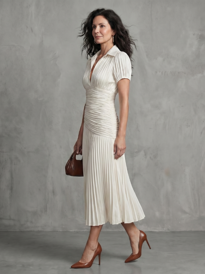 Women's striped midi dress, pleated, short-sleeved, and collared, ideal for everyday elegance.