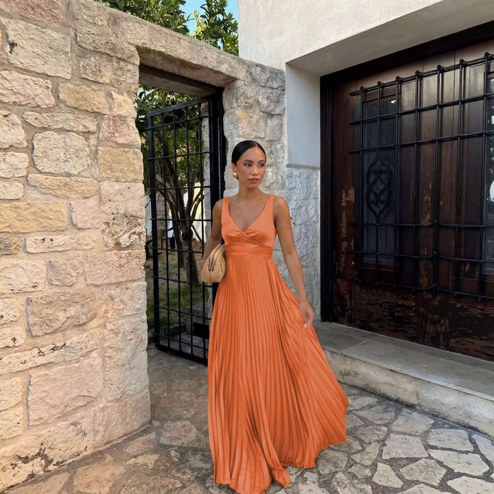 Women's elegant V-neck pleated formal maxi dress, perfect as a wedding guest or party outfit.