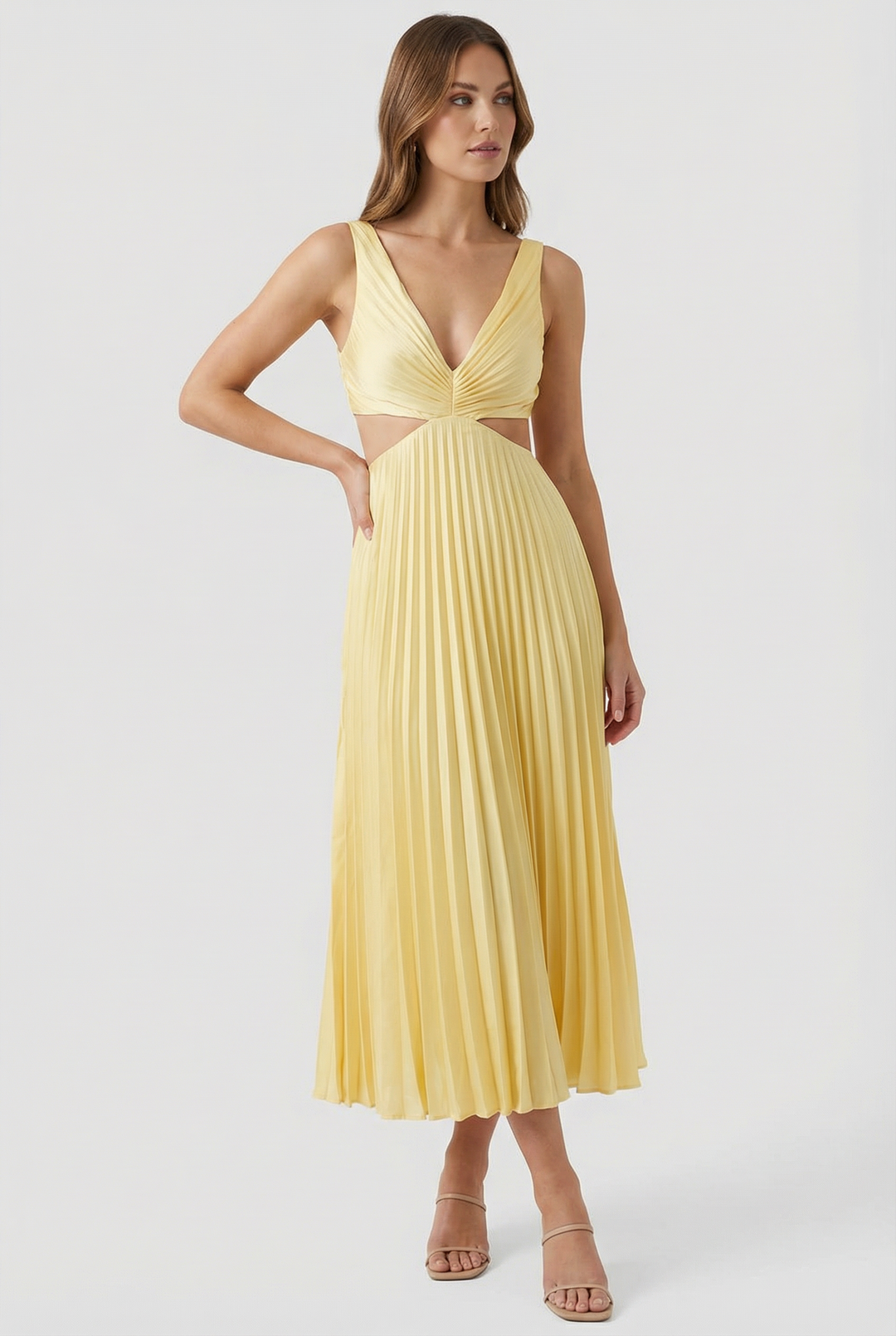 Full view of a woman in a black pleated V-neck maxi formal dress