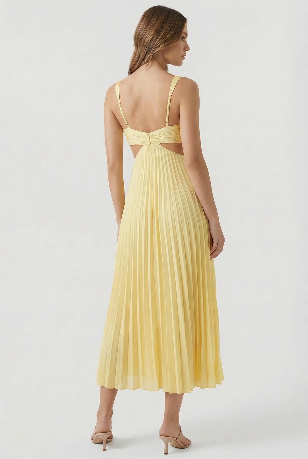 Close-up on the V-neckline and pleated fabric of an elegant women's maxi dress