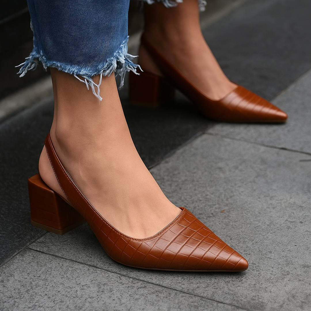 Stylish women's pointed toe ballet flats with slingback strap, ideal for sophisticated everyday fashion.