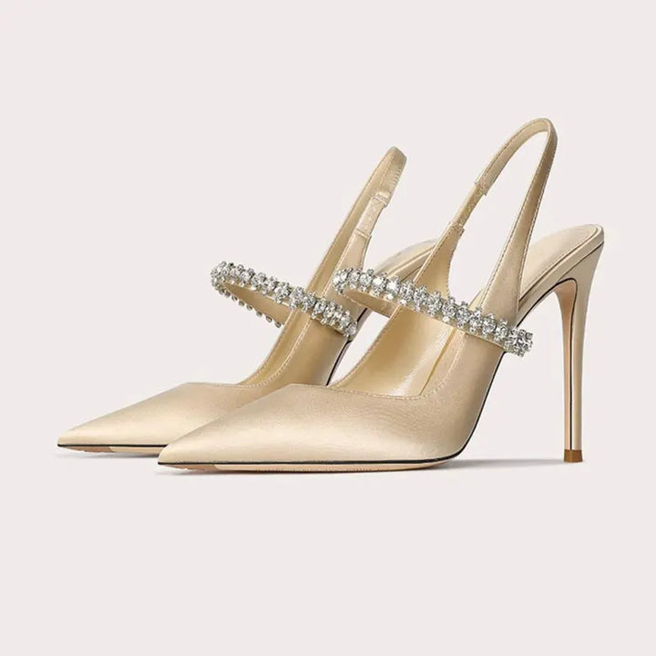 Elegant women's pointed-toe slingback heels with sparkling jeweled ankle strap, perfect for parties & evening wear.