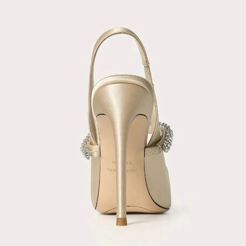 Luxurious women's pointed toe slingback heels with a shimmering jeweled ankle strap, perfect for elegant formal events.
