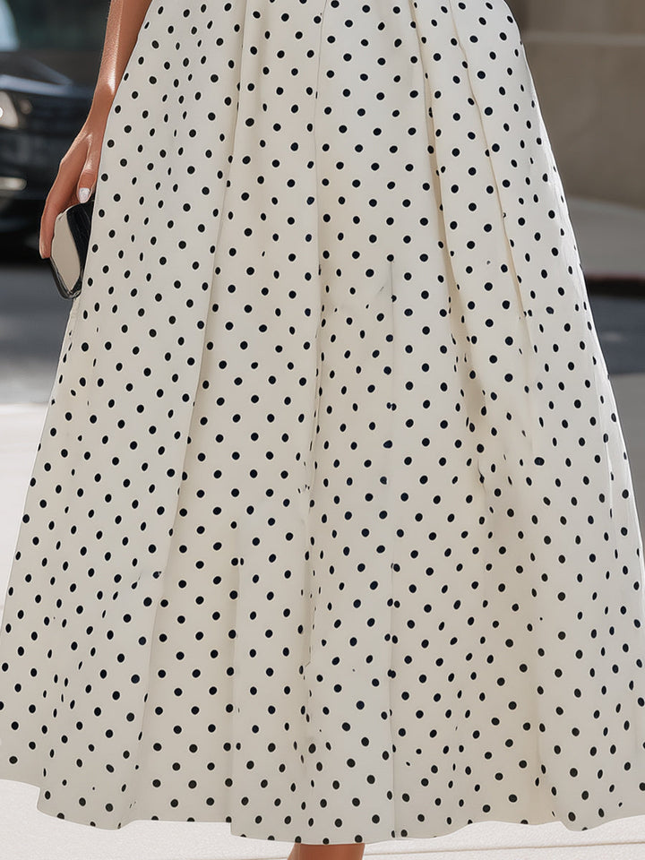 Elegant vintage-inspired polka dot A-line midi dress for women, sleeveless, great for garden parties & summer occasions.
