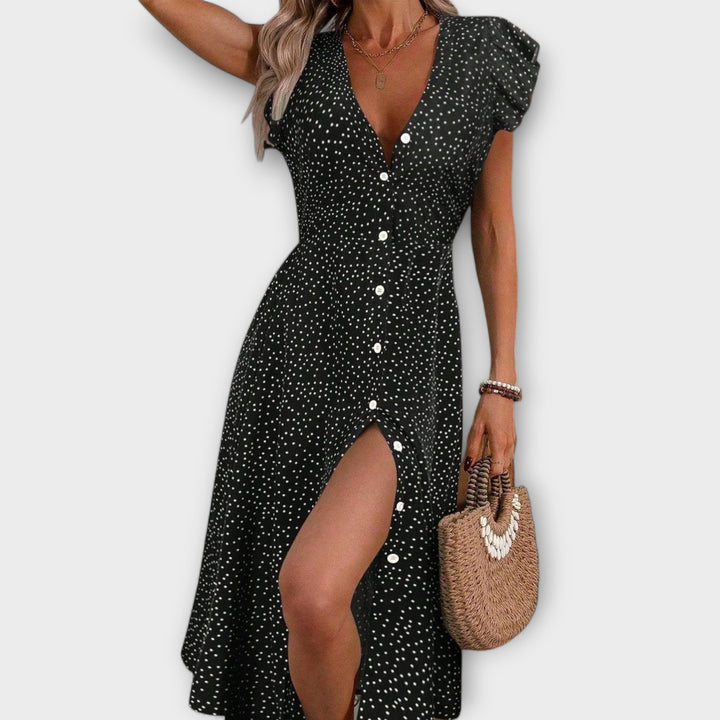 Flattering A-line silhouette polka dot midi dress for women, an elegant V-neck style for spring/summer.