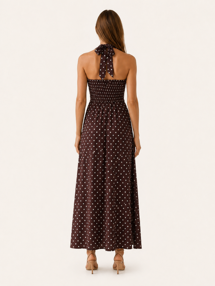 Stylish women's halter neck polka dot maxi dress, ideal for any occasion from casual weekends to elegant evenings.