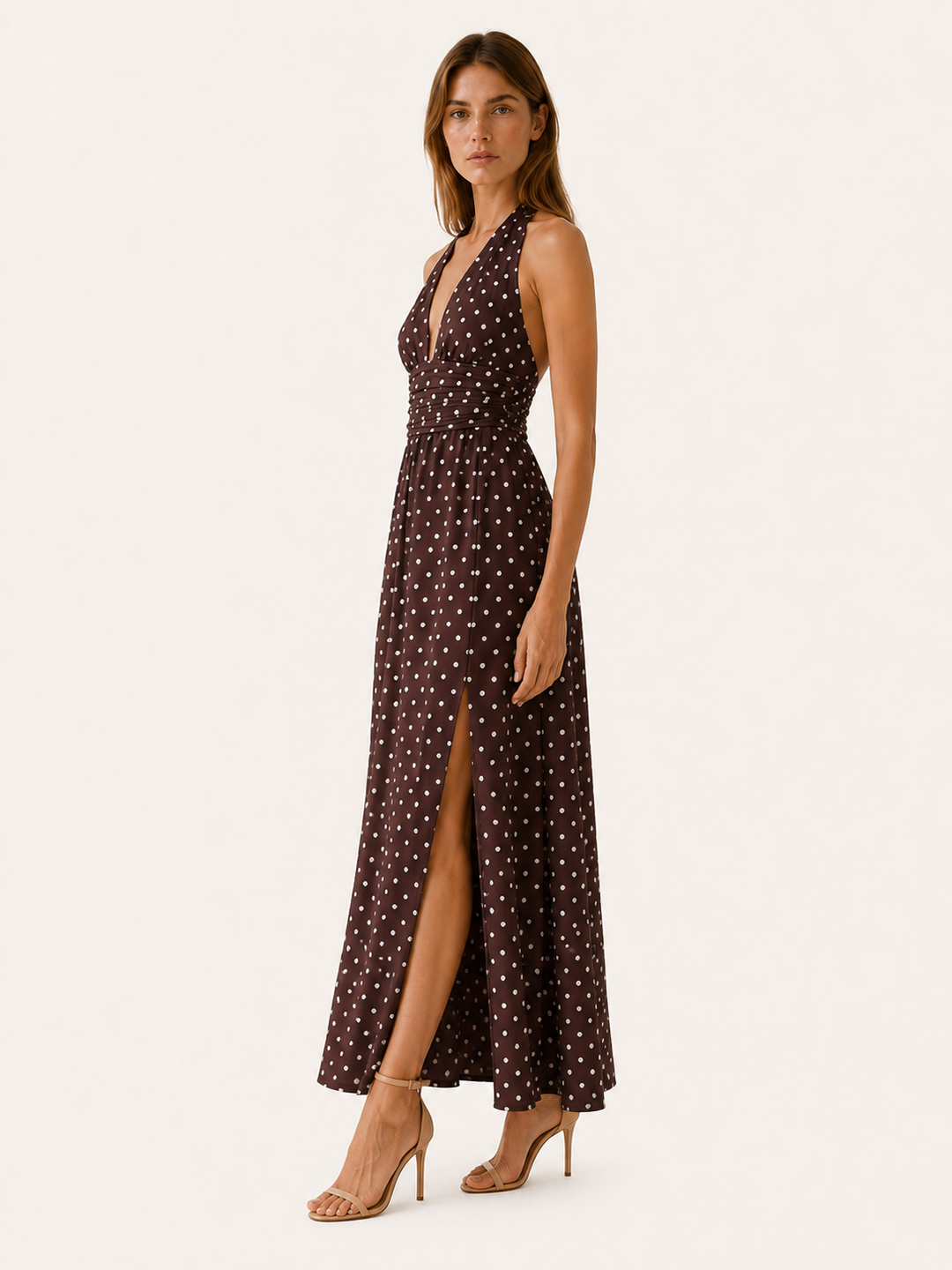 Flowy polka dot maxi dress with elegant halter neckline for women. A flattering, comfortable choice for any event.