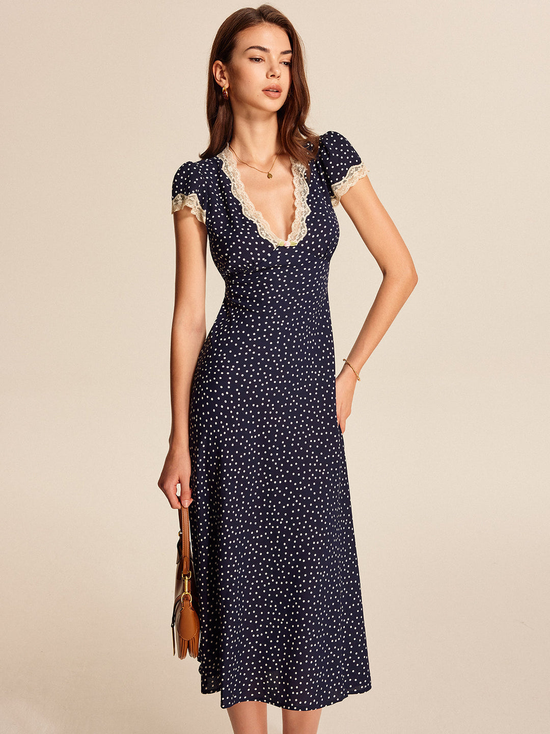 Chic women's polka dot midi dress with lace & puff sleeves, perfect summer dress for elegant occasions & evening wear.