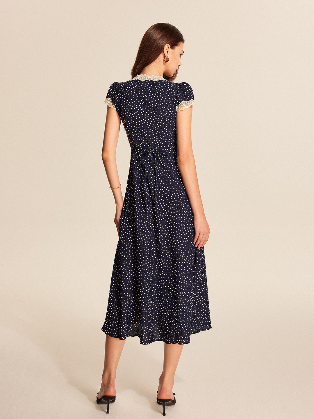 Fashionable women's polka dot midi dress with graceful lace & puff sleeves. An elegant choice for any summer occasion.