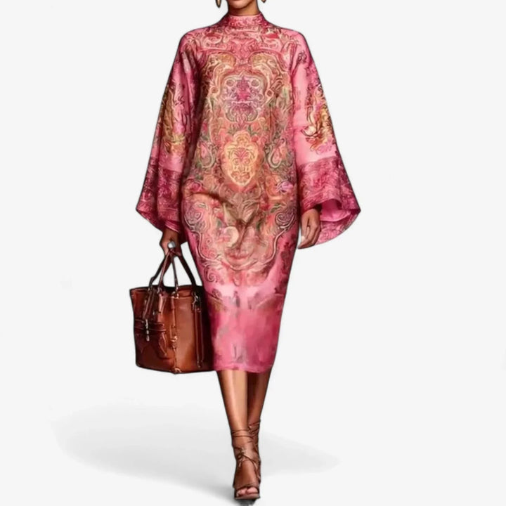 Elegant women's printed caftan midi dress with mock neck & batwing sleeves, ideal for resort wear. Flowy pink fabric.