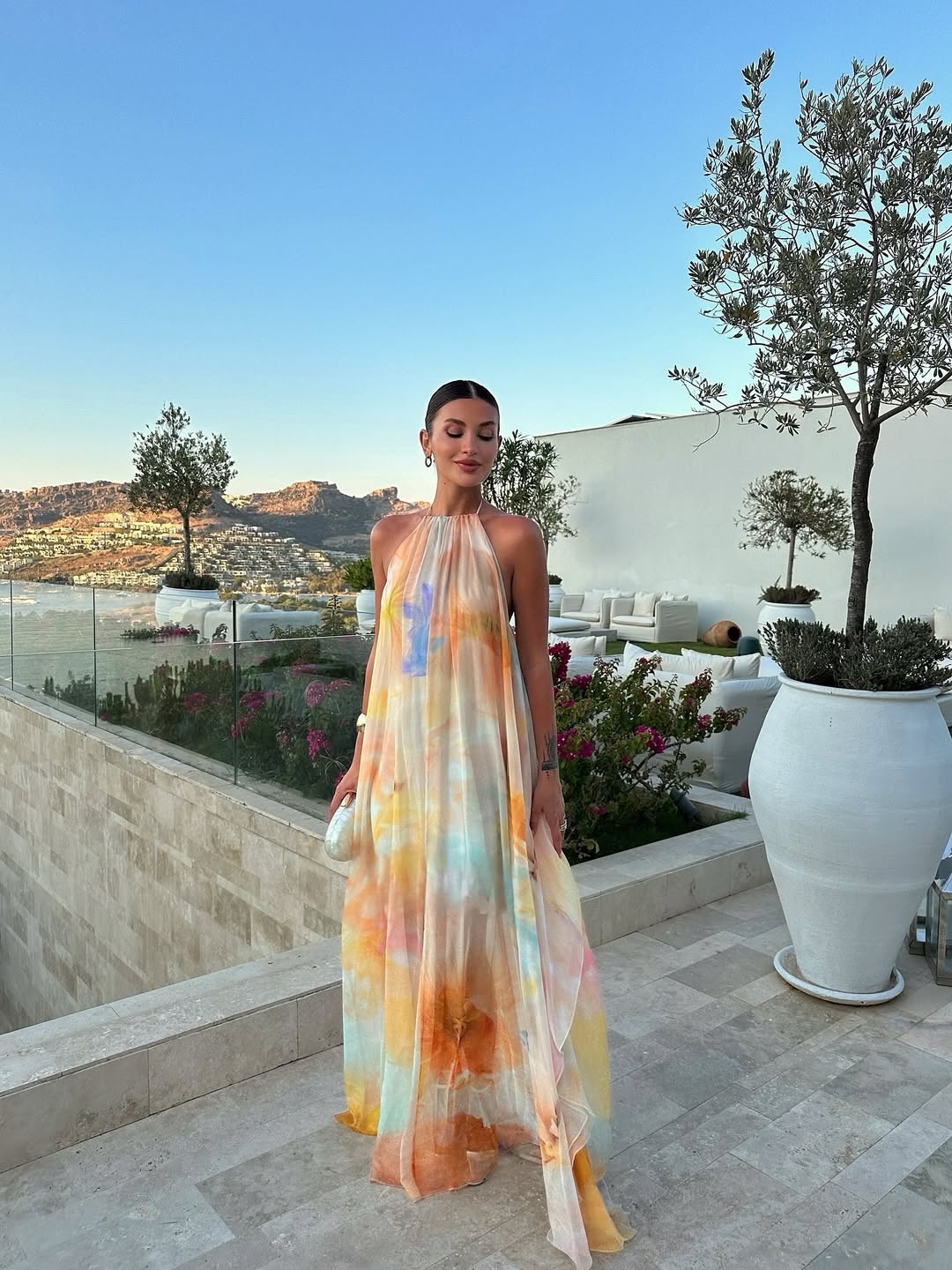 Vibrant printed halter maxi dress for women, featuring a flowy silhouette perfect for summer fashion & elegance.