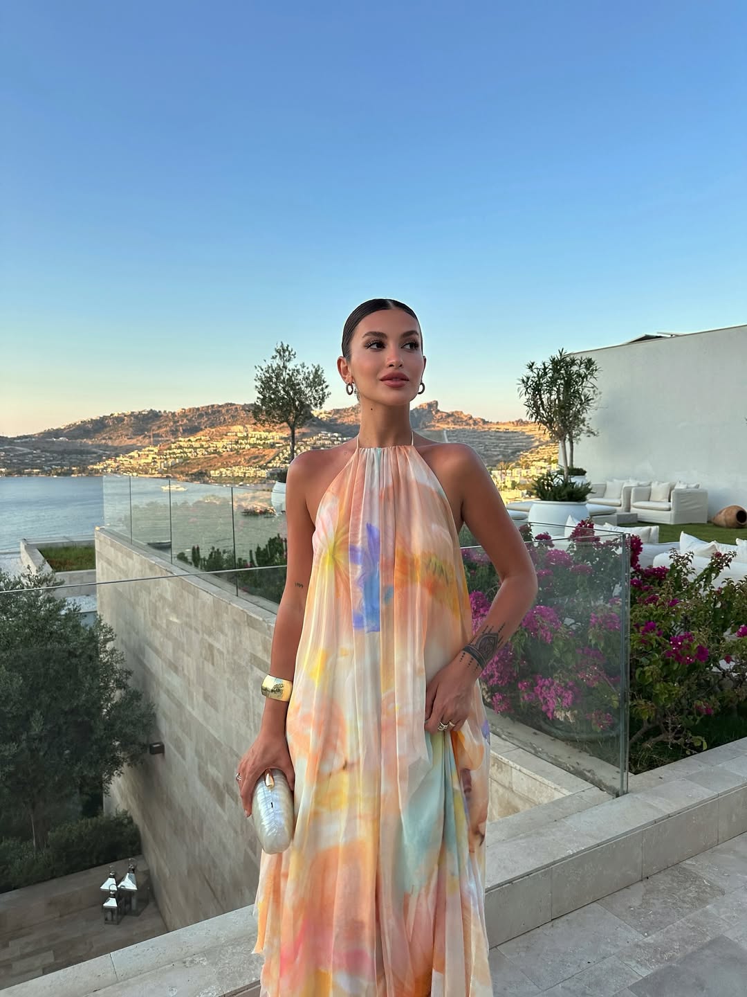 Fashionable women's printed halter maxi dress, ideal for summer, vacation, and party wear. Offers a flattering fit.