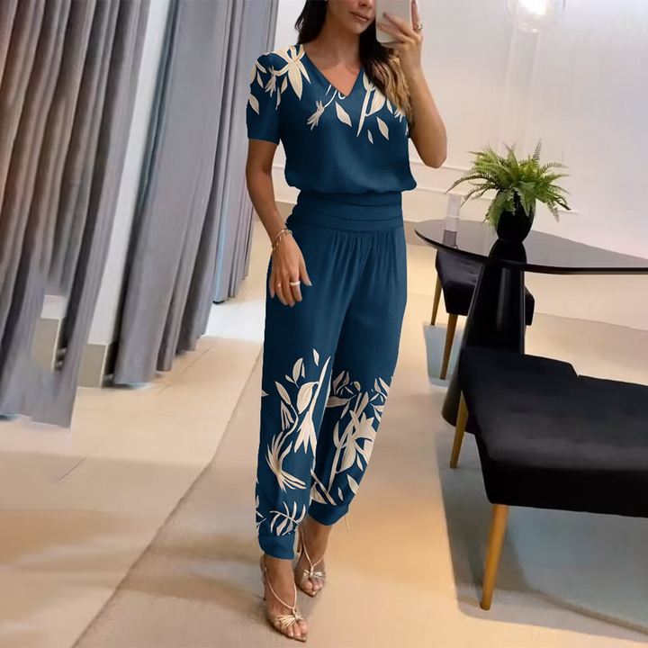 Stylish women's printed jumpsuit, perfect for summer casual wear. Features a chic V-neck, wide legs & tie waist.