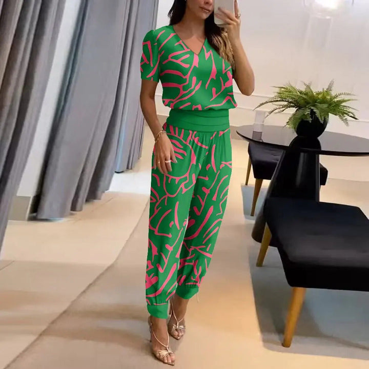 Vibrant printed women's jumpsuit with a flattering V-neck, comfortable wide legs, and an adjustable tie waist.