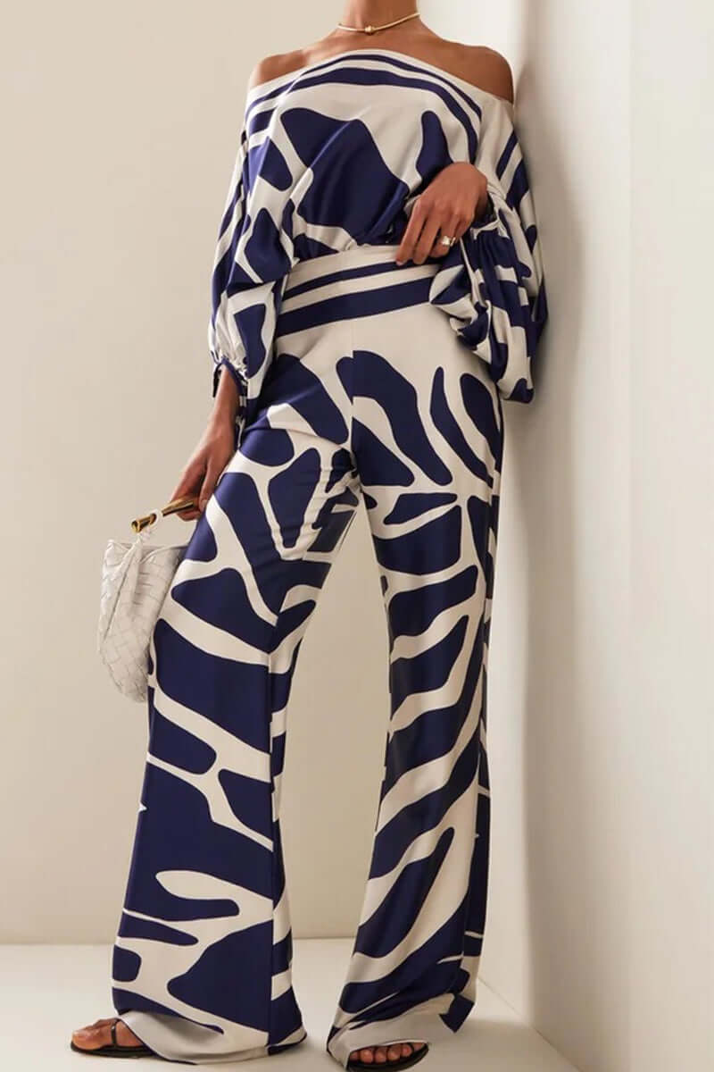 Elegant women's printed off-shoulder long sleeve two-piece set, ideal for parties & winter outfits.