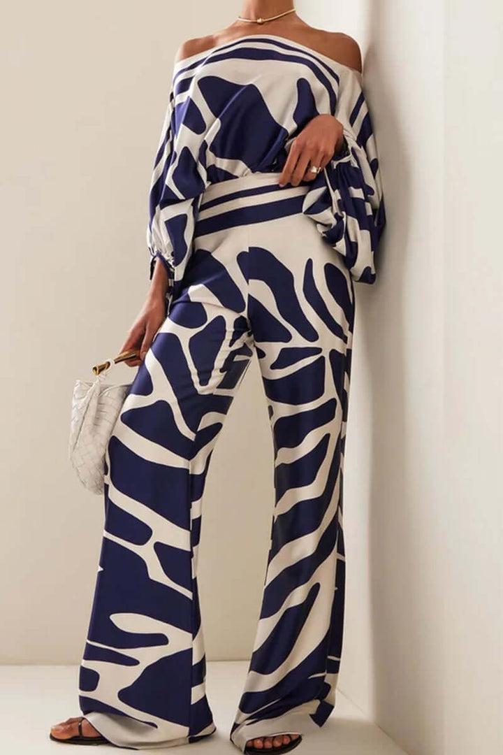 Elegant women's printed off-shoulder long sleeve two-piece set, ideal for parties & winter outfits.