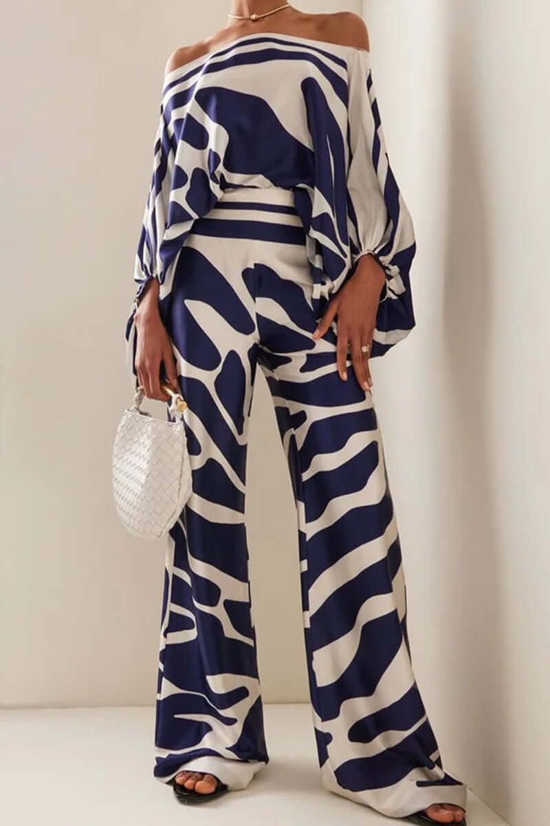 Women's two-piece skirt set with a printed off-shoulder long sleeve top & matching elegant skirt.