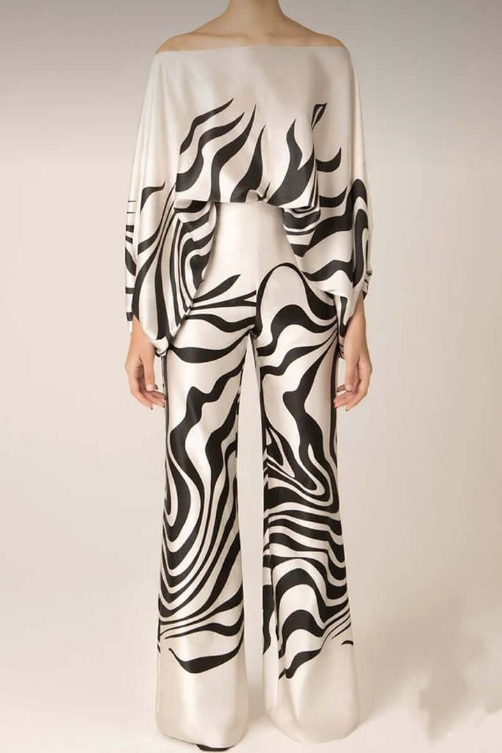 Stylish women's printed off-shoulder long sleeve skirt set, perfect for versatile winter party wear.