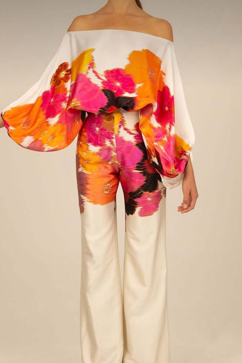 Elegant women's printed long sleeve off-shoulder two-piece skirt set, great for versatile party wear.