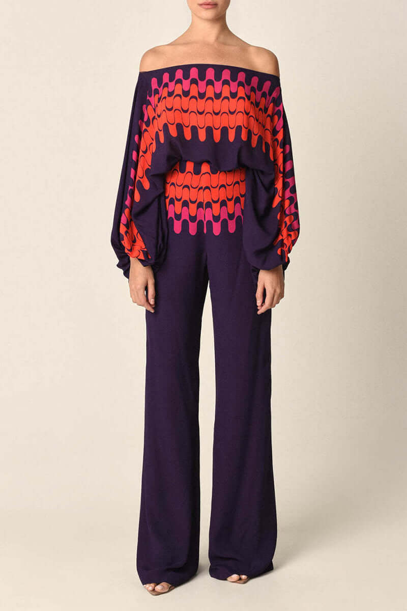 Fashionable women's printed off-shoulder long sleeve two-piece skirt set, ideal for winter elegance.