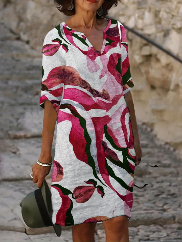 Stylish women's elegant printed summer dress, knee-length, perfect for vacation, beach, or day events.