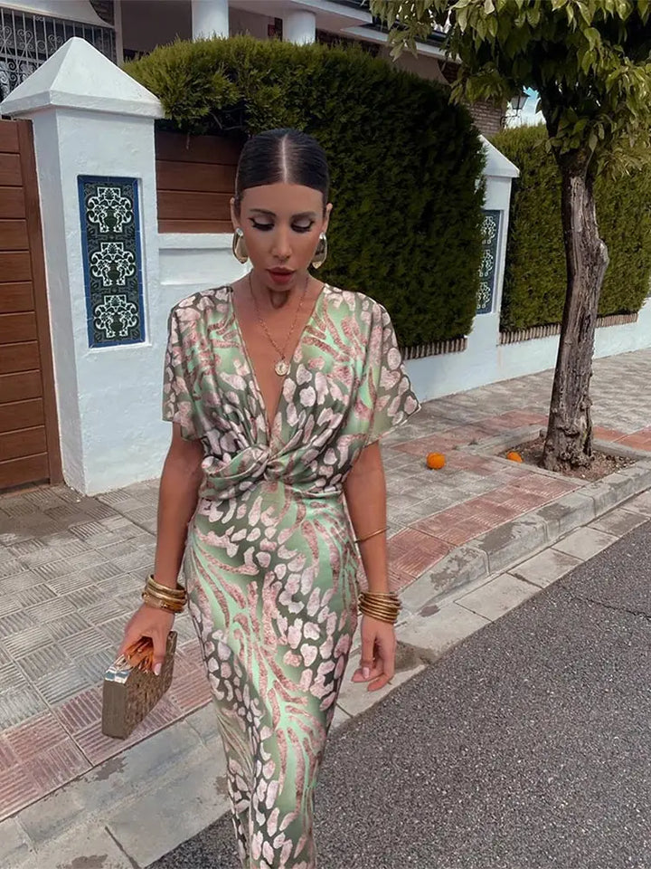 Elegant women's printed twist-front midi dress, perfect for wedding guests or special occasions.
