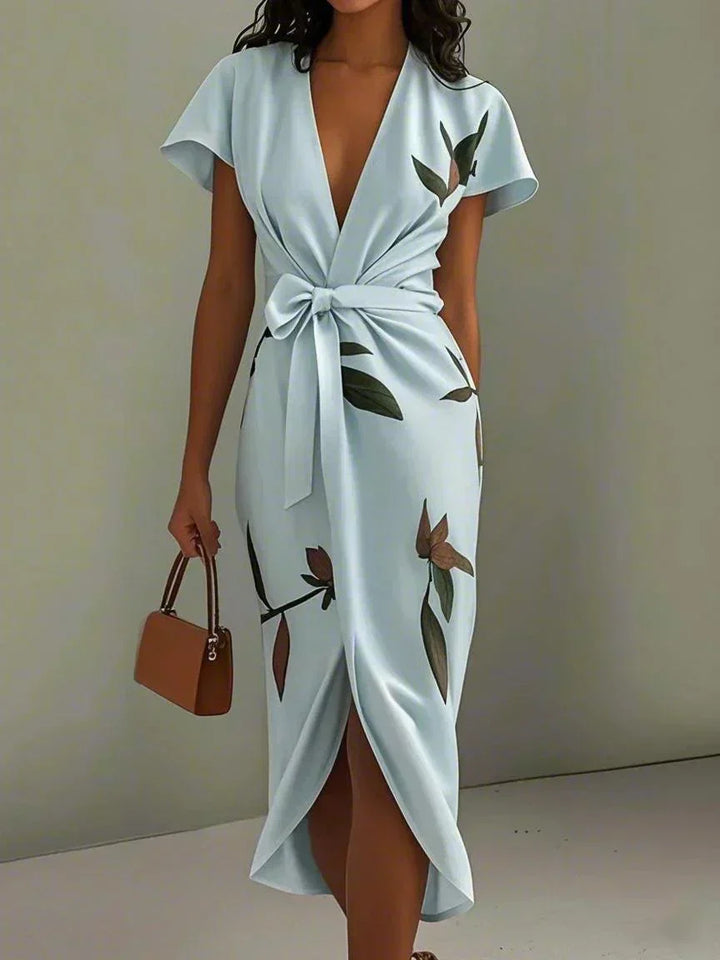 Stylish women's printed wrap midi dress featuring a chic V-neck and adjustable tie waist, great for a flattering fit.